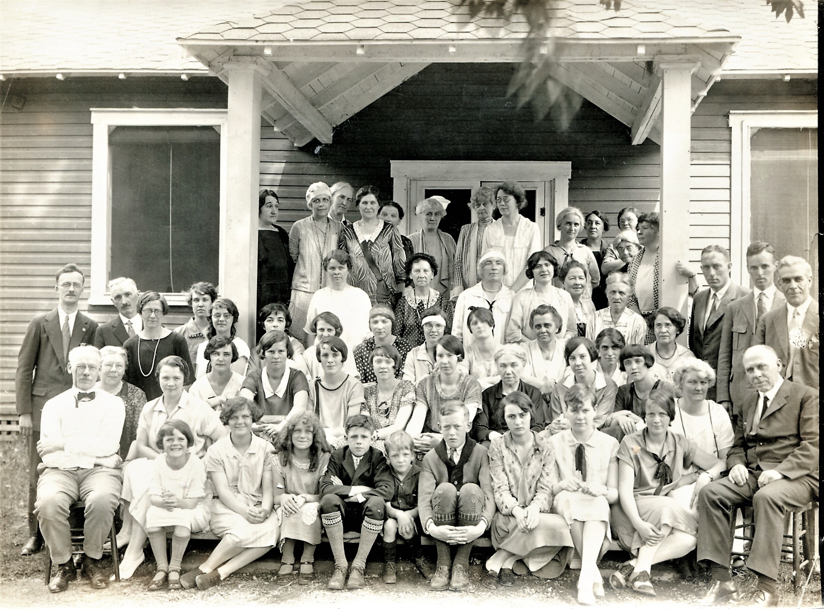 Jordan, Carrie with group in front of house